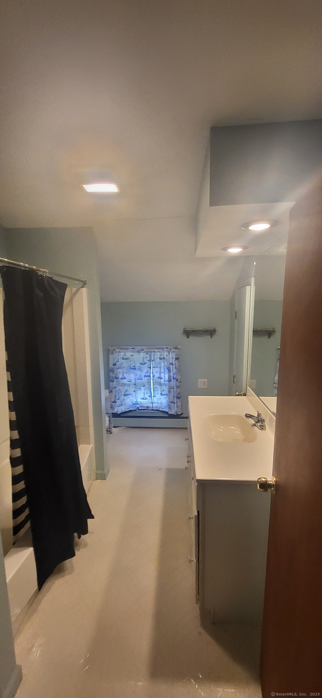 179 High Street Sprague, CT 06330 - Photo 2 of 9 a bathroom with a sink a toilet and mirror