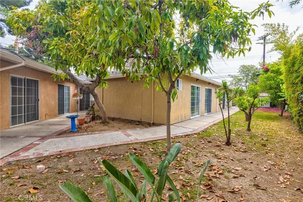 a house view with a backyard space