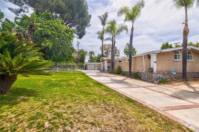 a living room with a large bed and a large window