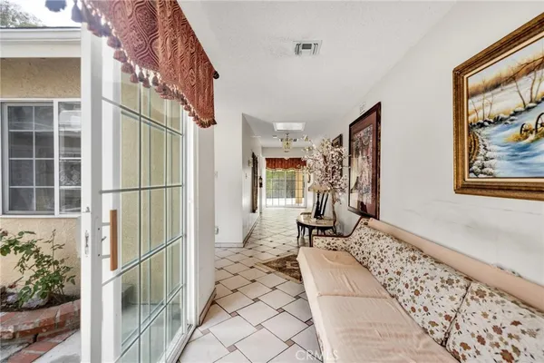 a view of a very nice looking dining room with a table and chairs