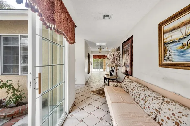 a view of a very nice looking dining room with a table and chairs