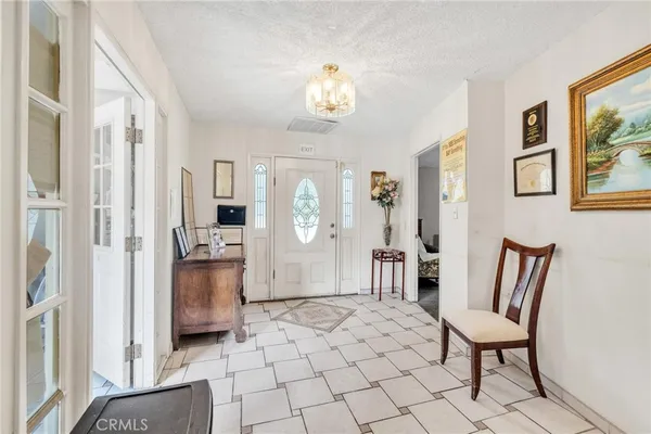 a bedroom with furniture and a flat screen tv