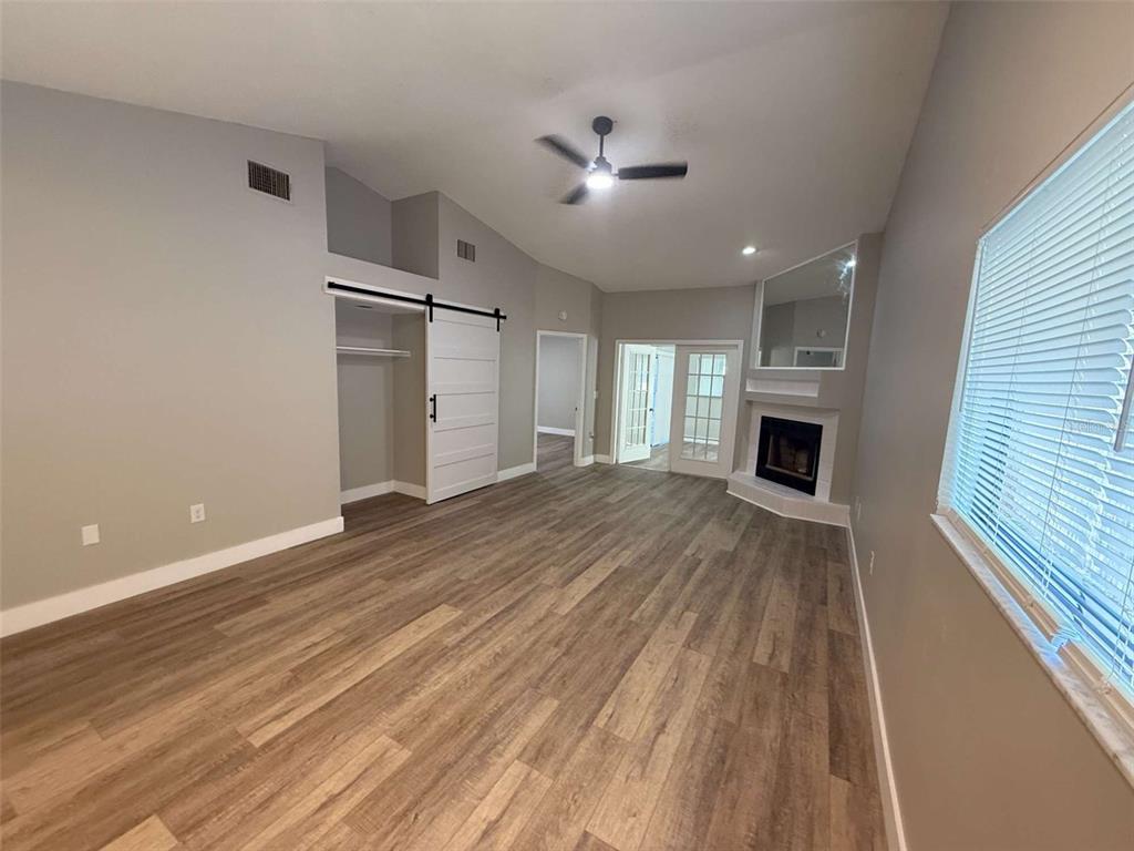 3588 Raintree Lane Lakeland, FL 33803 - Photo 2 of 15 a view of empty room with wooden floor and fireplace