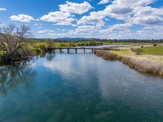 0 Spring Creek Road Fall River Mills, CA 96028 - Photo 41 of 60 a view of a lake with houses in the back