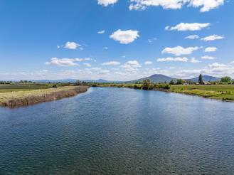0 Spring Creek Road Fall River Mills, CA 96028 - Photo 44 of 60 a view of a lake with houses in the back