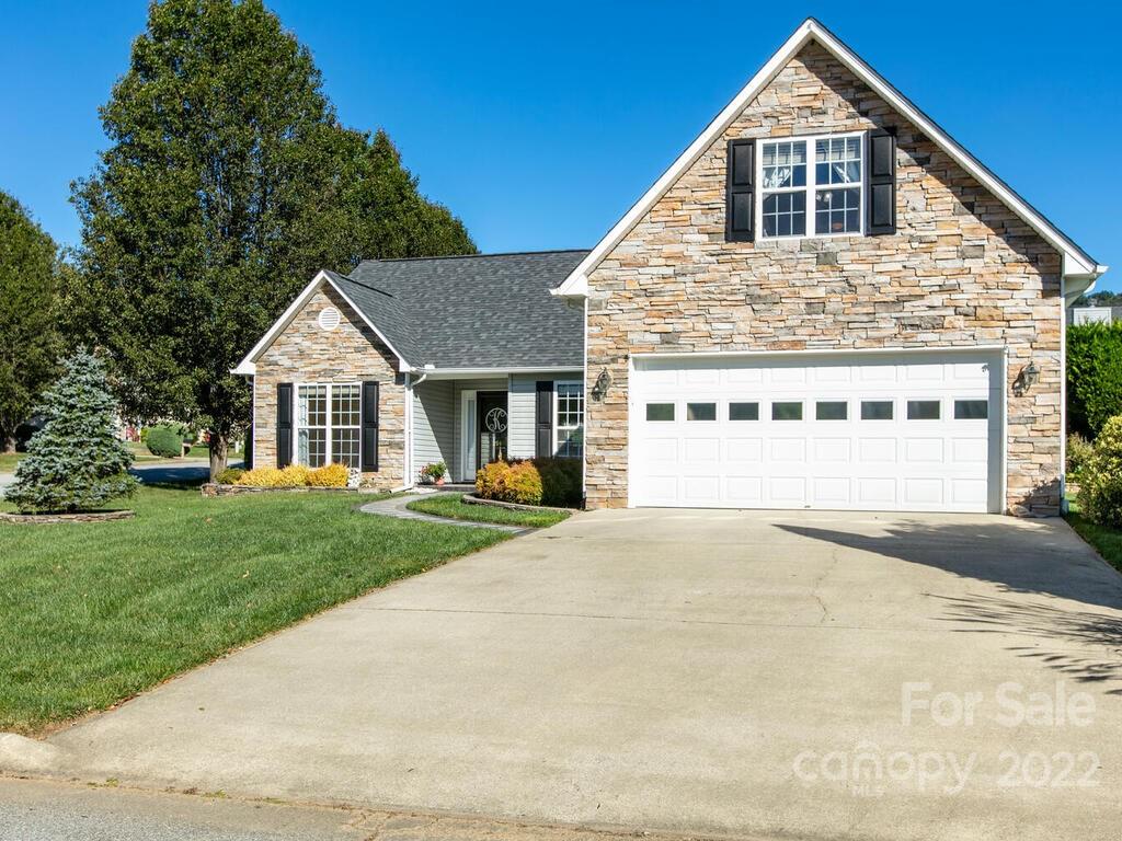 294 Farm Valley Road Fletcher, NC 28732 - Photo 2 of 36 a view of a house with a yard and garage