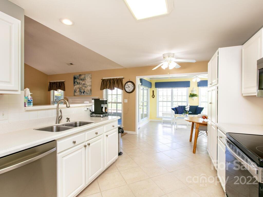 294 Farm Valley Road Fletcher, NC 28732 - Photo 9 of 36 a large kitchen with a lot of counter space and a sink