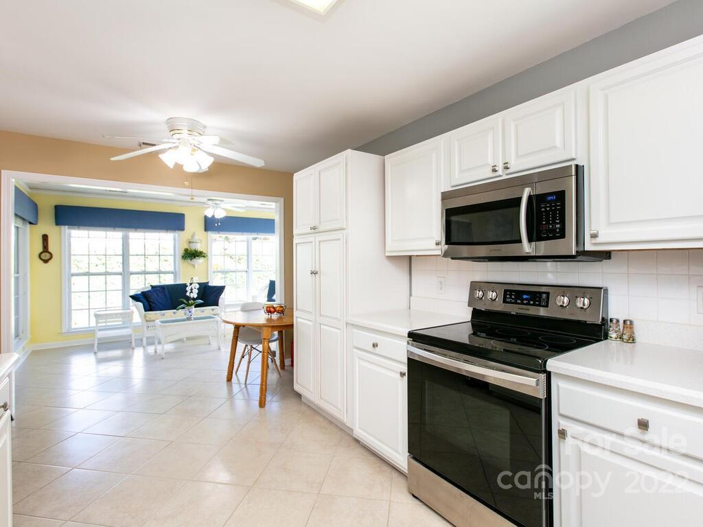 294 Farm Valley Road Fletcher, NC 28732 - Photo 10 of 36 a kitchen with a stove and a microwave