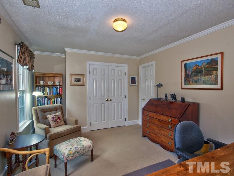 8917 Wildwood Links Raleigh, NC 27613 - Photo 18 of 25 a living room with furniture