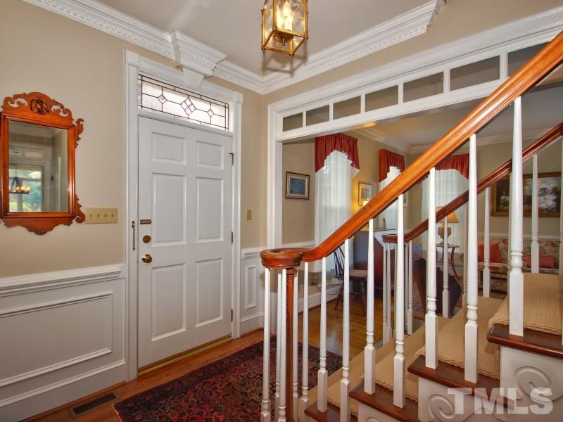 8917 Wildwood Links Raleigh, NC 27613 - Photo 20 of 25 a view of an entryway with hardwood