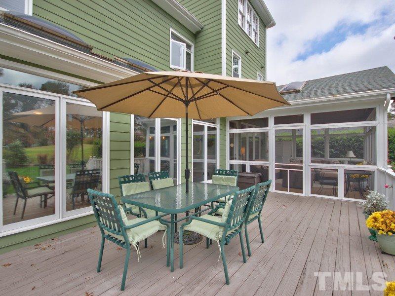 8917 Wildwood Links Raleigh, NC 27613 - Photo 21 of 25 a view of a chair and table on the deck