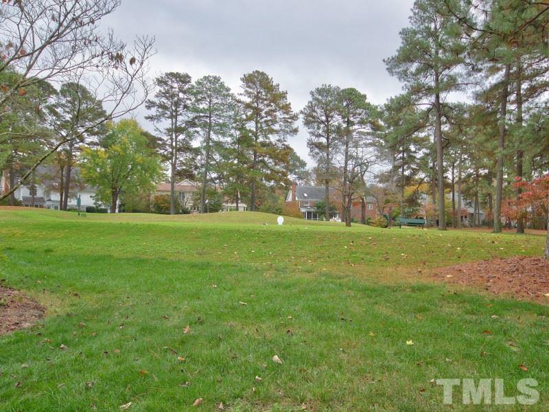 8917 Wildwood Links Raleigh, NC 27613 - Photo 23 of 25 a view of building with trees