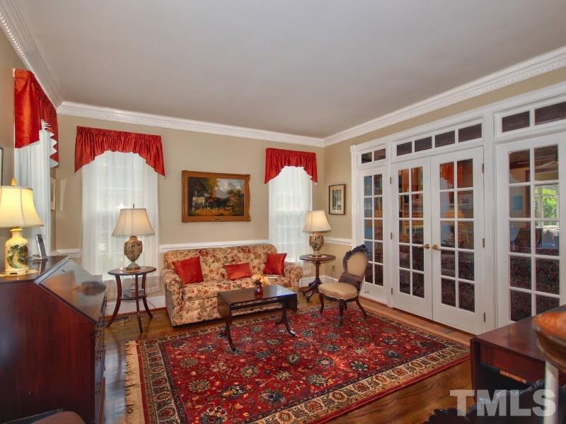 8917 Wildwood Links Raleigh, NC 27613 - Photo 5 of 25 a living room with furniture and a fireplace