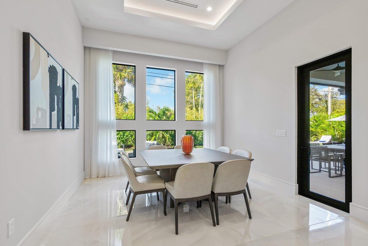 1099 Northeast 2nd Terrace Boca Raton, FL 33432 - Photo 14 of 43 a dining room with furniture and window