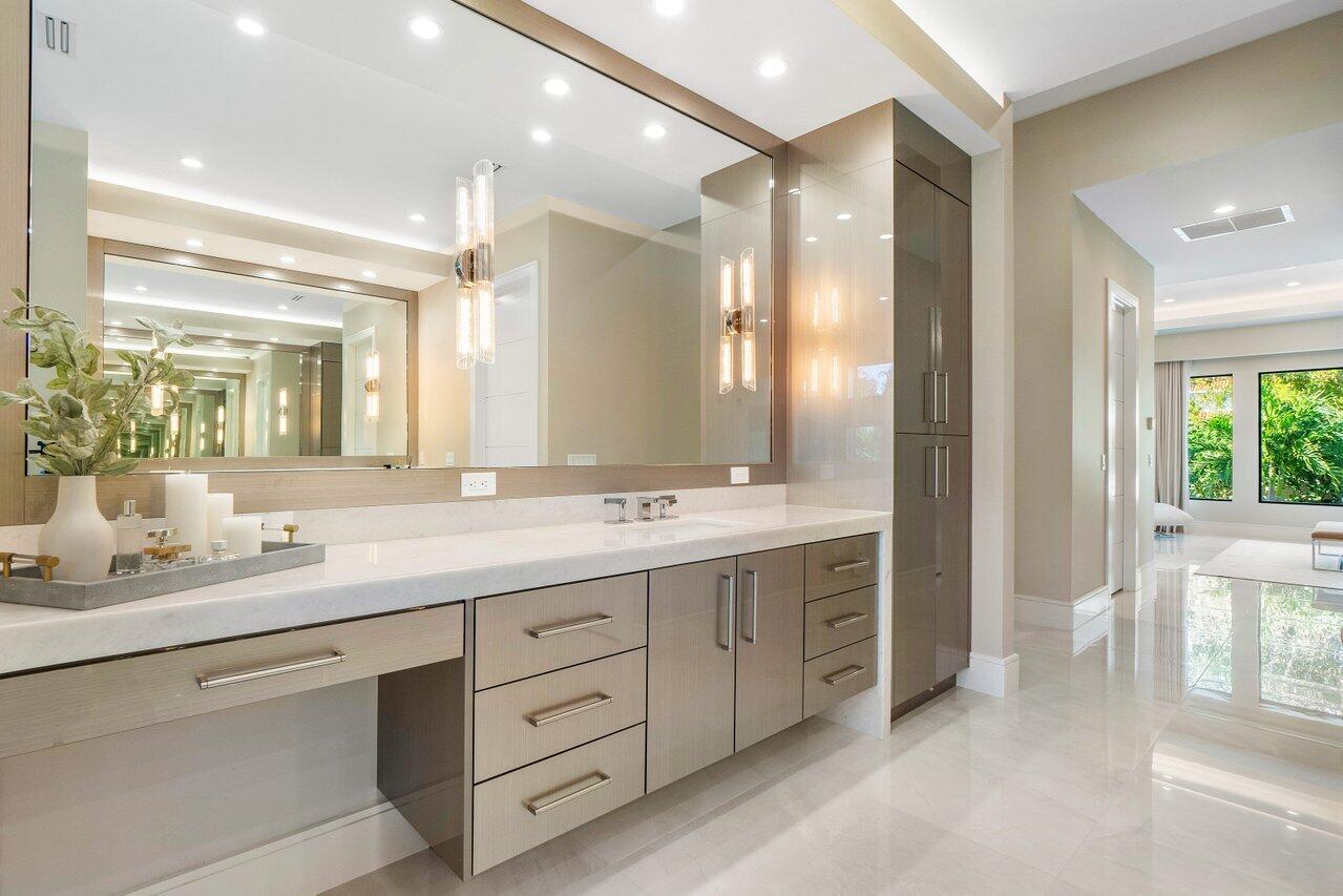 1099 Northeast 2nd Terrace Boca Raton, FL 33432 - Photo 19 of 43 a bathroom with a double vanity sink and a mirror