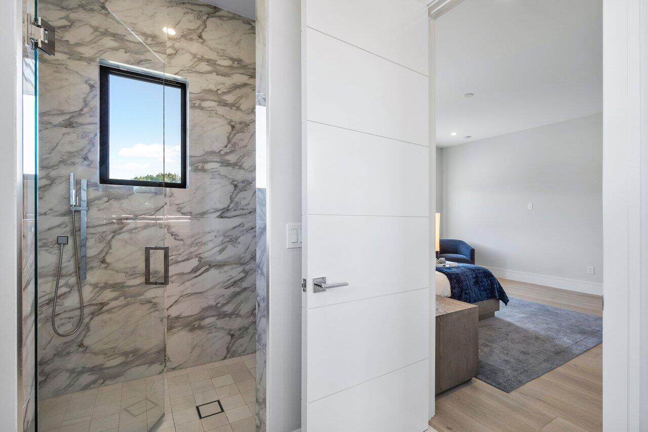 1099 Northeast 2nd Terrace Boca Raton, FL 33432 - Photo 28 of 43 a bathroom with a shower