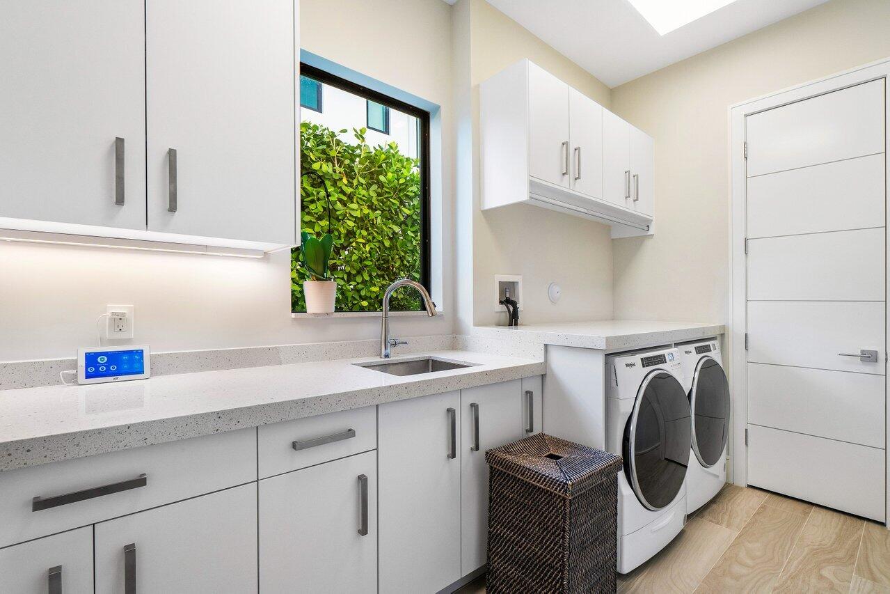 1099 Northeast 2nd Terrace Boca Raton, FL 33432 - Photo 38 of 43 a utility room with sink dryer and washer