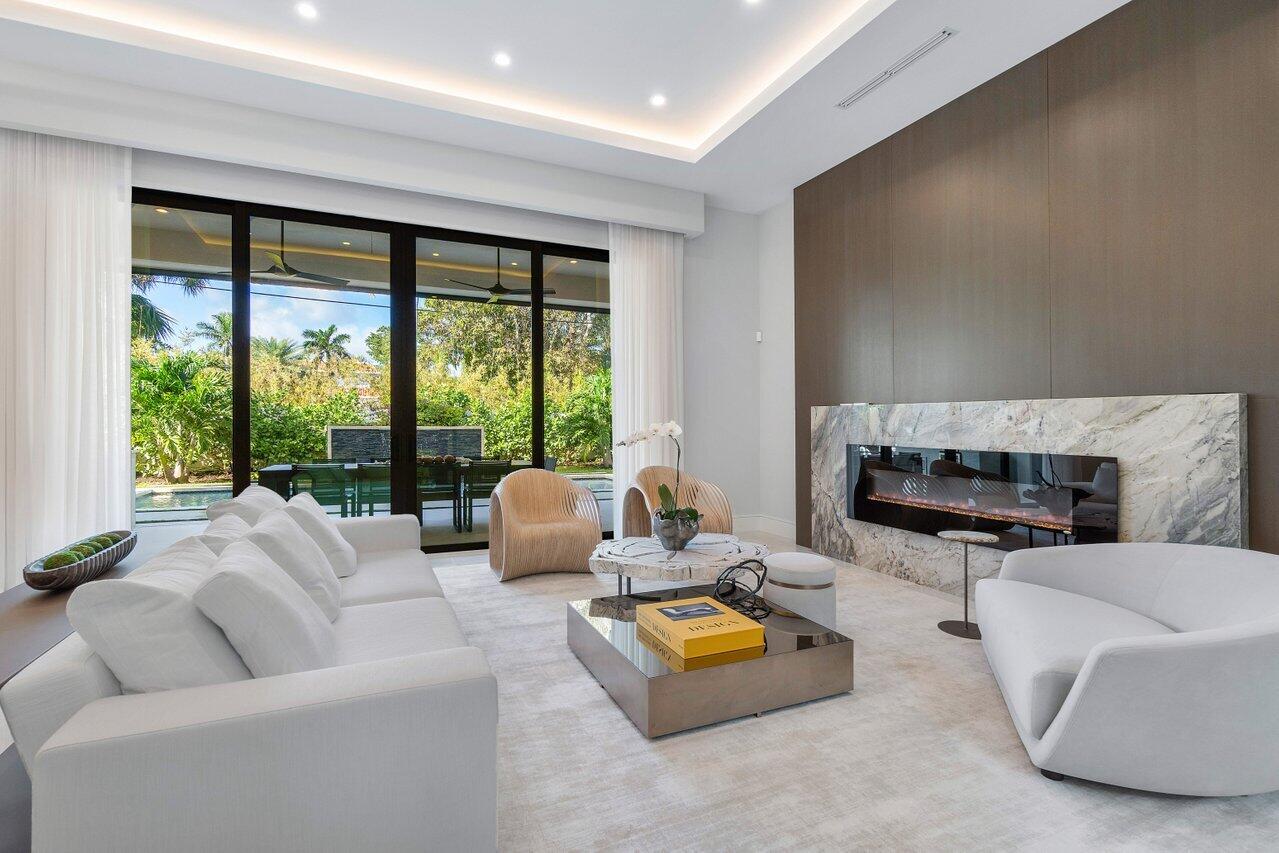 1099 Northeast 2nd Terrace Boca Raton, FL 33432 - Photo 6 of 43 a living room with furniture and a fireplace