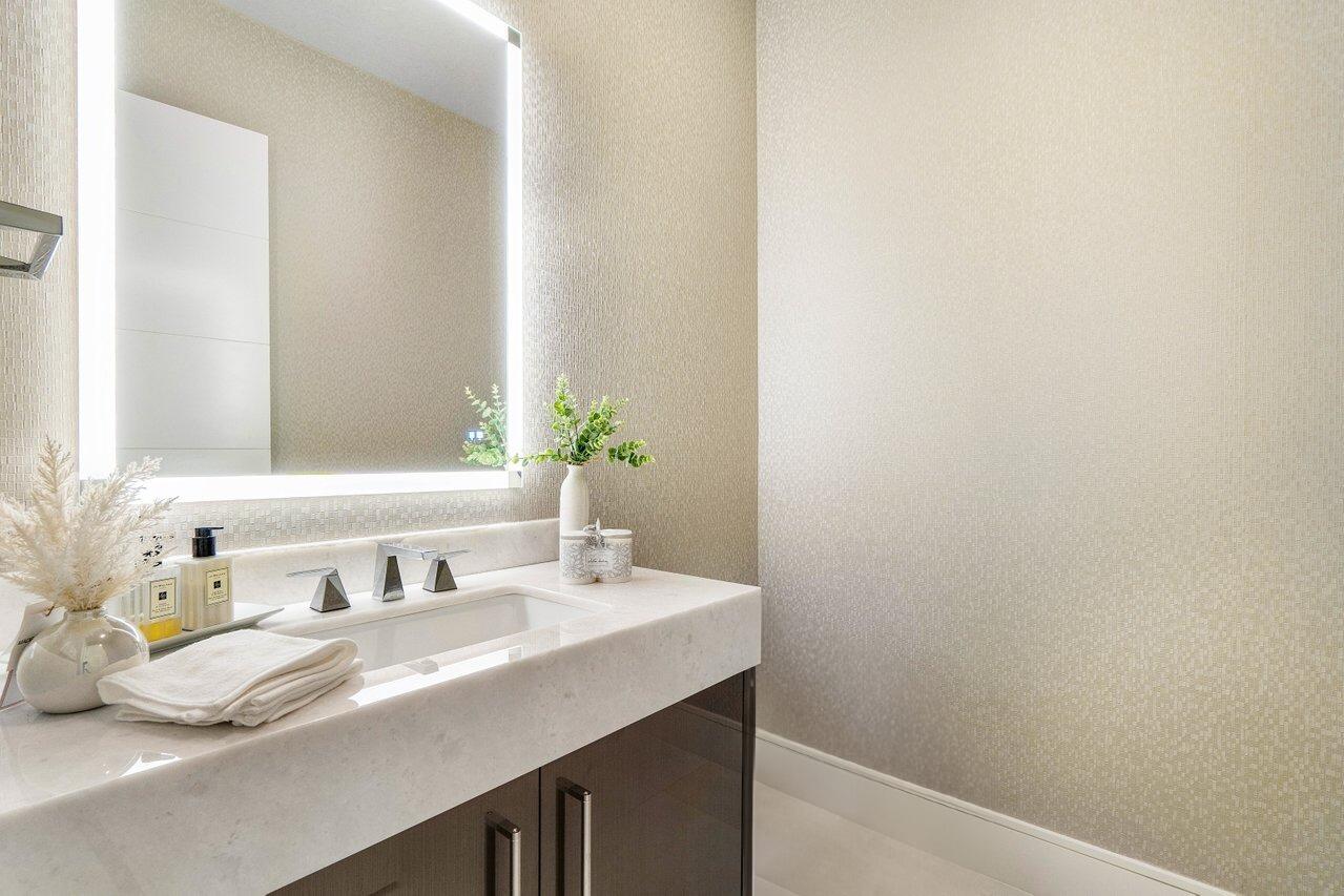1099 Northeast 2nd Terrace Boca Raton, FL 33432 - Photo 9 of 43 a bathroom with a sink and a mirror