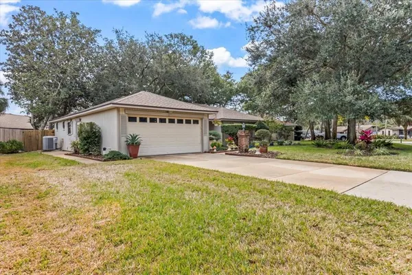 a view of an house with backyard space and garden
