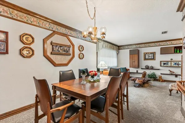 a view of a table and chairs in a room