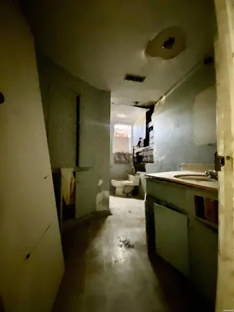 a kitchen with a sink and a refrigerator