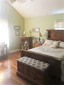 3797 Summitville Road Manchester, TN 37355 - Photo 5 of 10 a bedroom with a bed and wooden floor