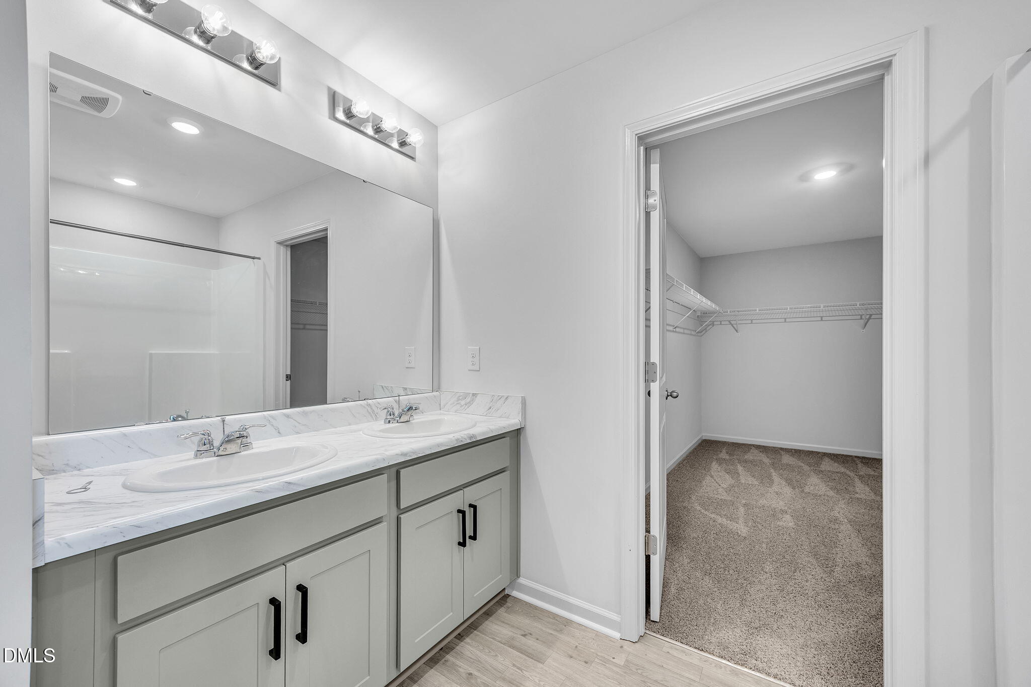 177 Yellowwood Avenue Spring Hope, NC 27882 - Photo 16 of 31 a bathroom with a granite countertop sink a mirror and a shower