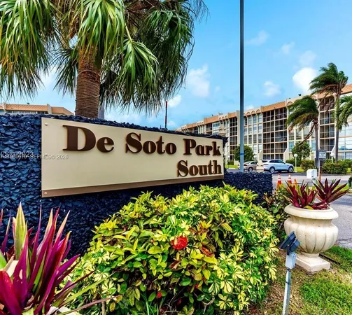 a view of a sign board with potted plants