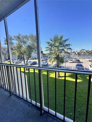 a view of swimming pool from a balcony