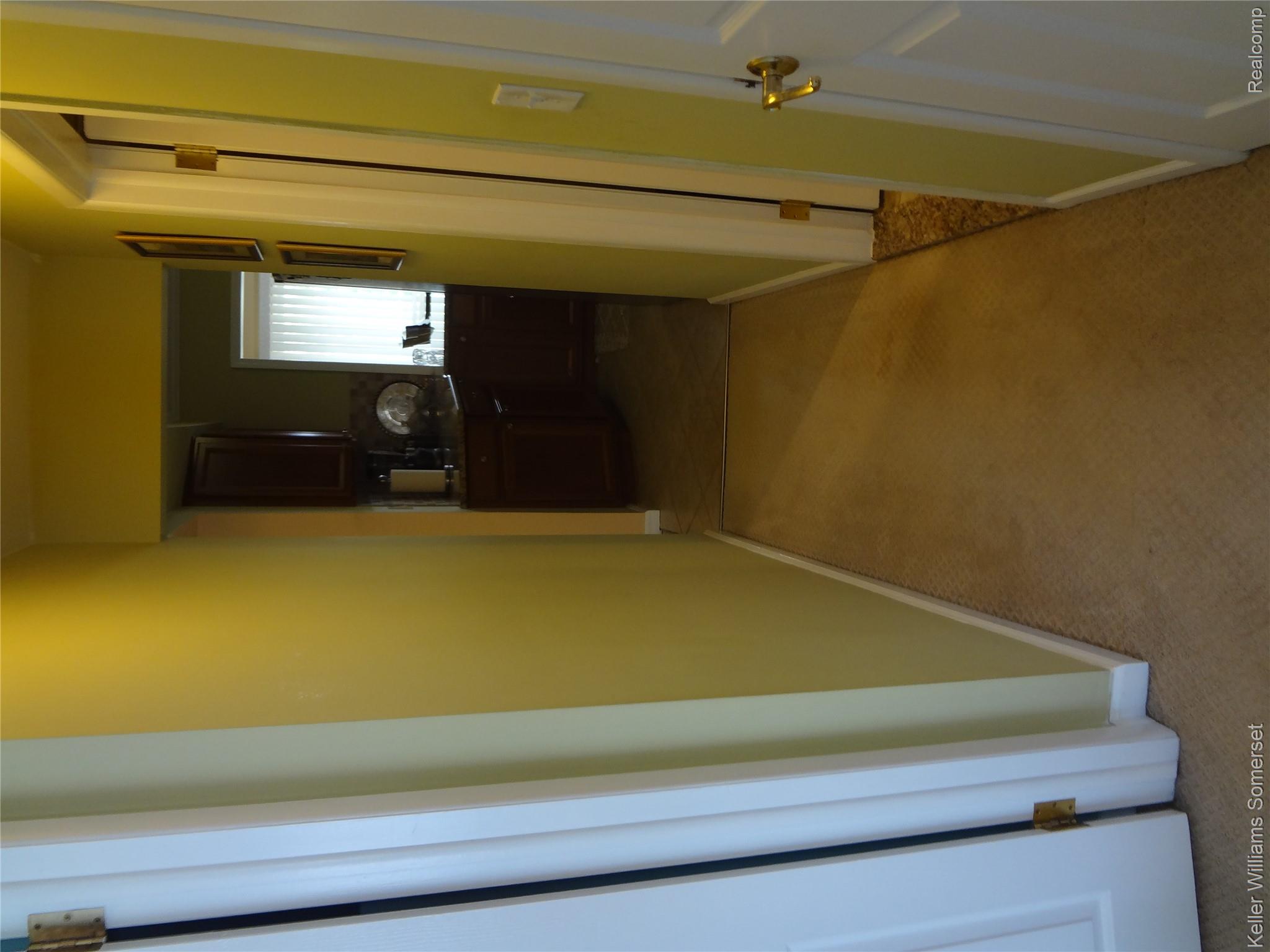 29626 Hoover Road, Unit 626 Warren, MI 48093 - Photo 22 of 35 Hallway with light carpet and baseboards