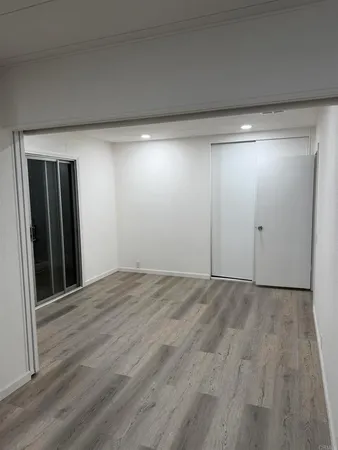 a bathroom with a shower sink and mirror