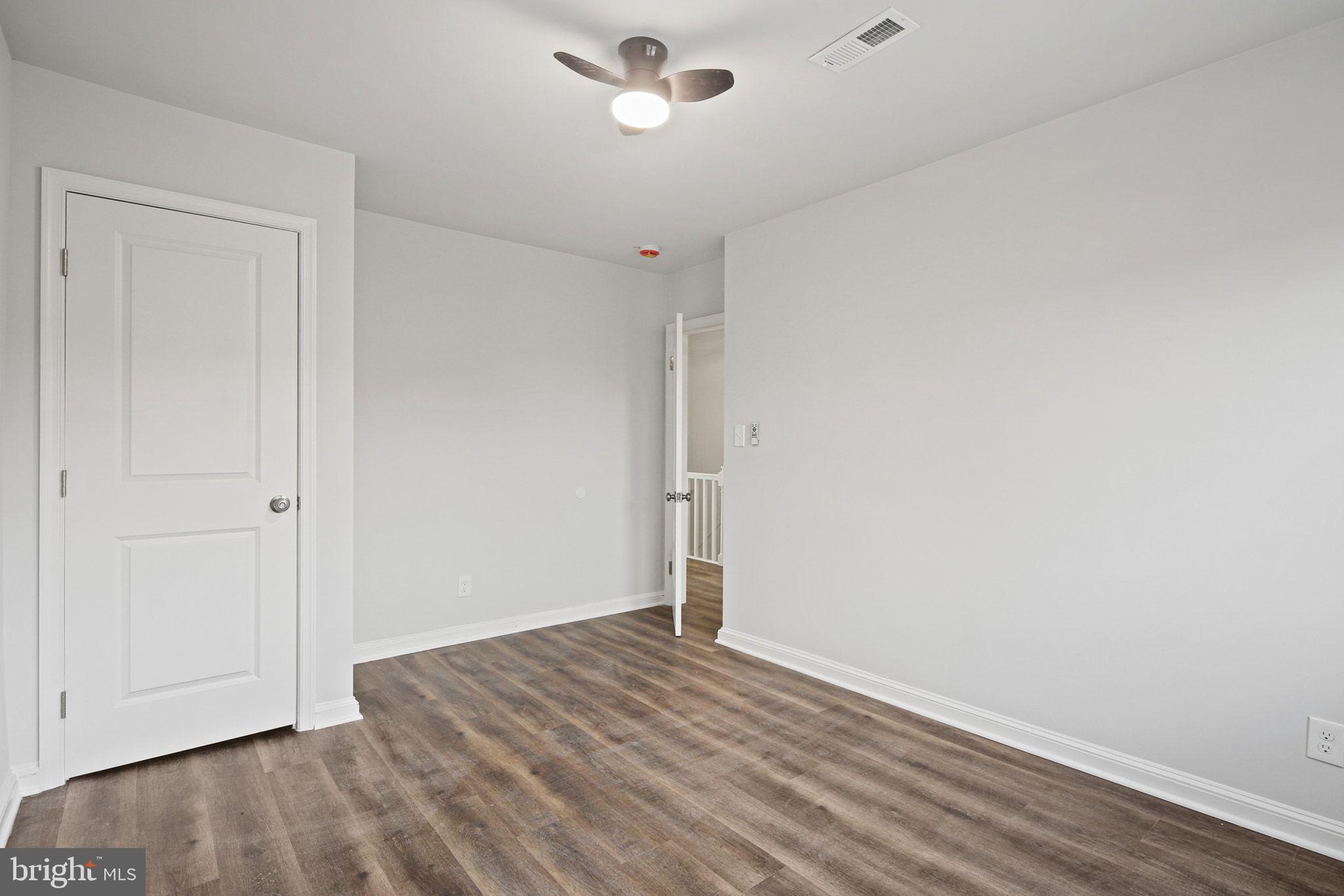 1322 Kitmore Road Baltimore, MD 21239 - Photo 20 of 34 a view of empty room with wooden floor