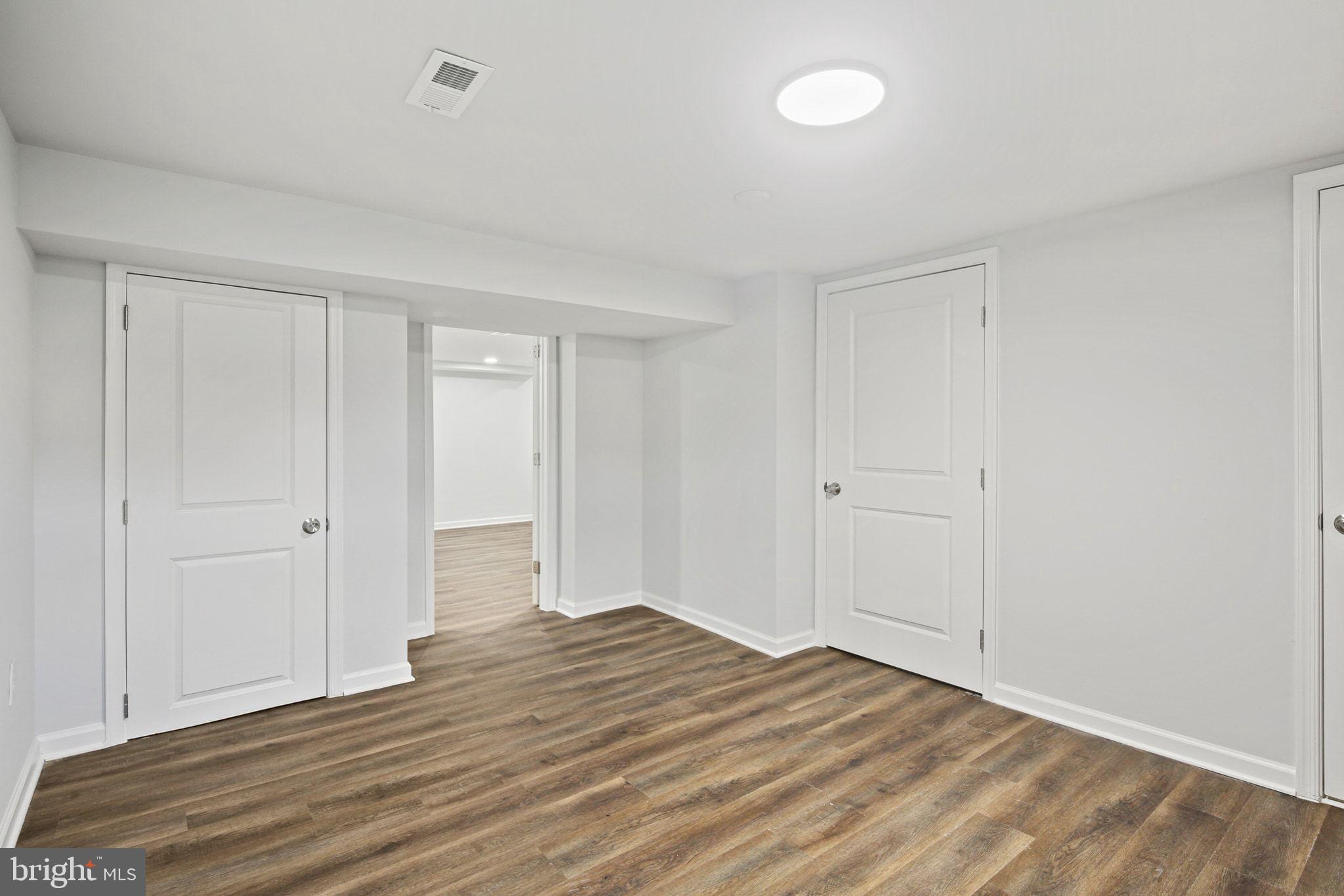 1322 Kitmore Road Baltimore, MD 21239 - Photo 27 of 34 a view of empty room with wooden floor