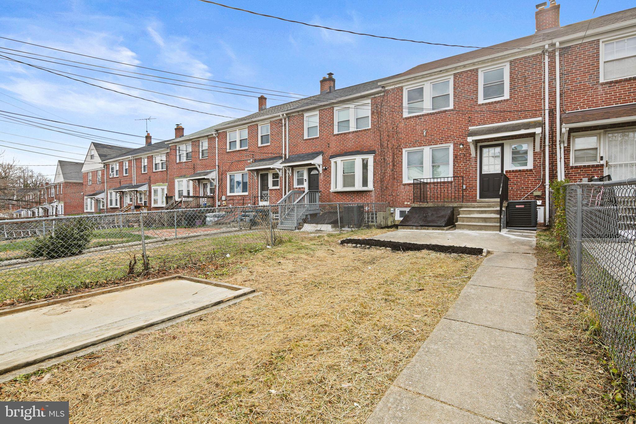 1322 Kitmore Road Baltimore, MD 21239 - Photo 32 of 34 a view of a building with a swimming pool