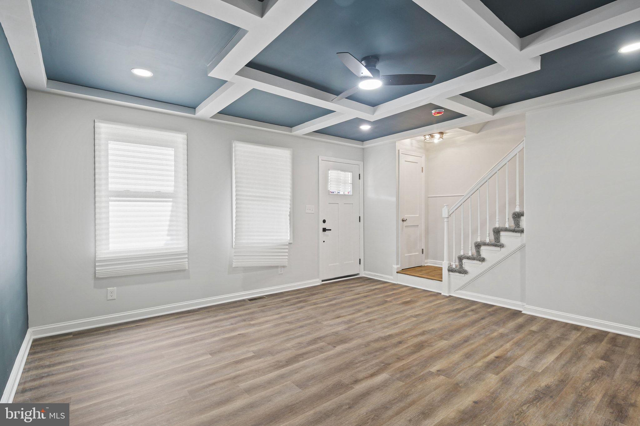 1322 Kitmore Road Baltimore, MD 21239 - Photo 6 of 34 a view of an empty room with wooden floor and a window