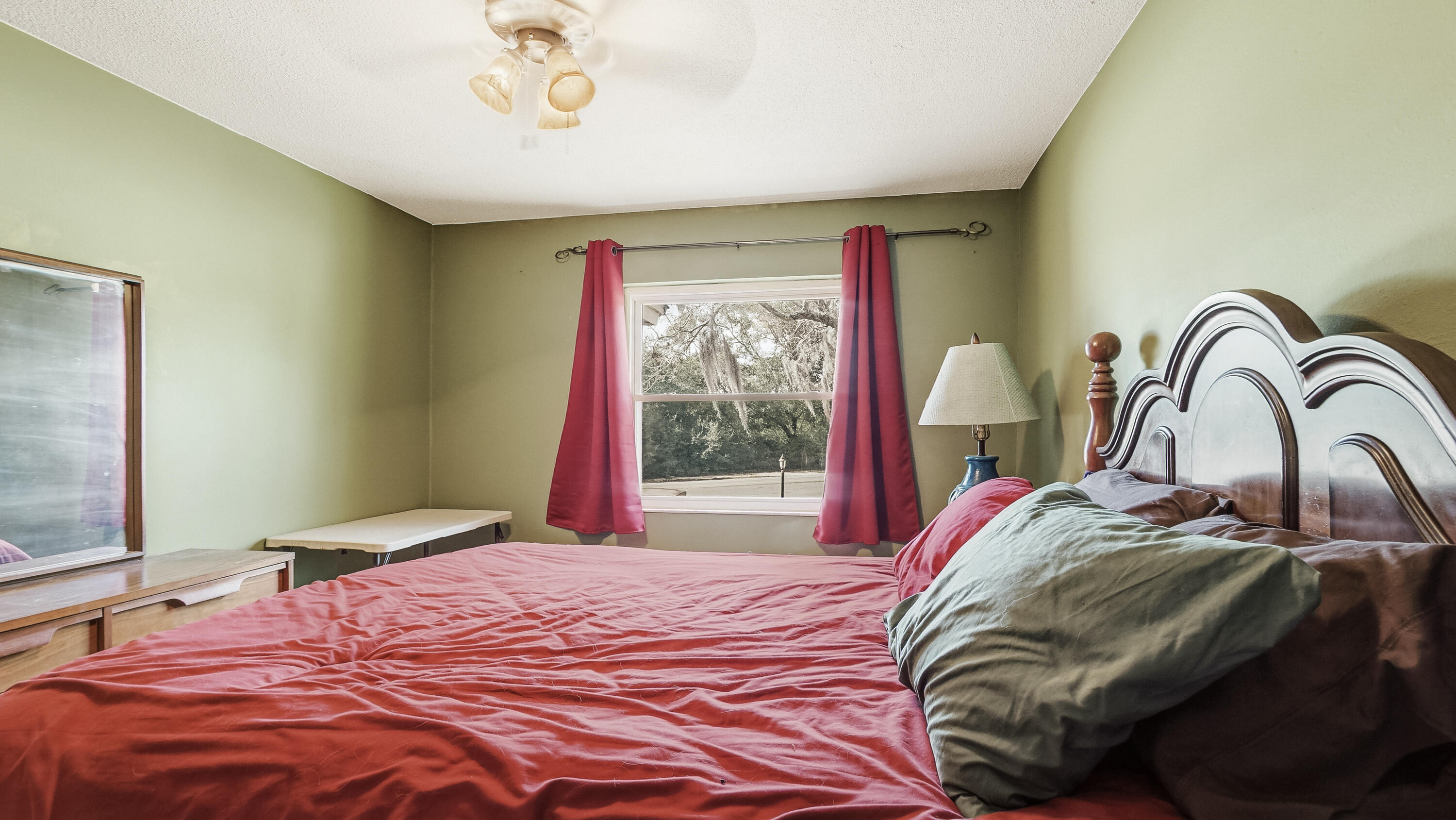 4335 Country Club Boulevard Chipley, FL 32428 - Photo 12 of 28 a bedroom with a bed and a window