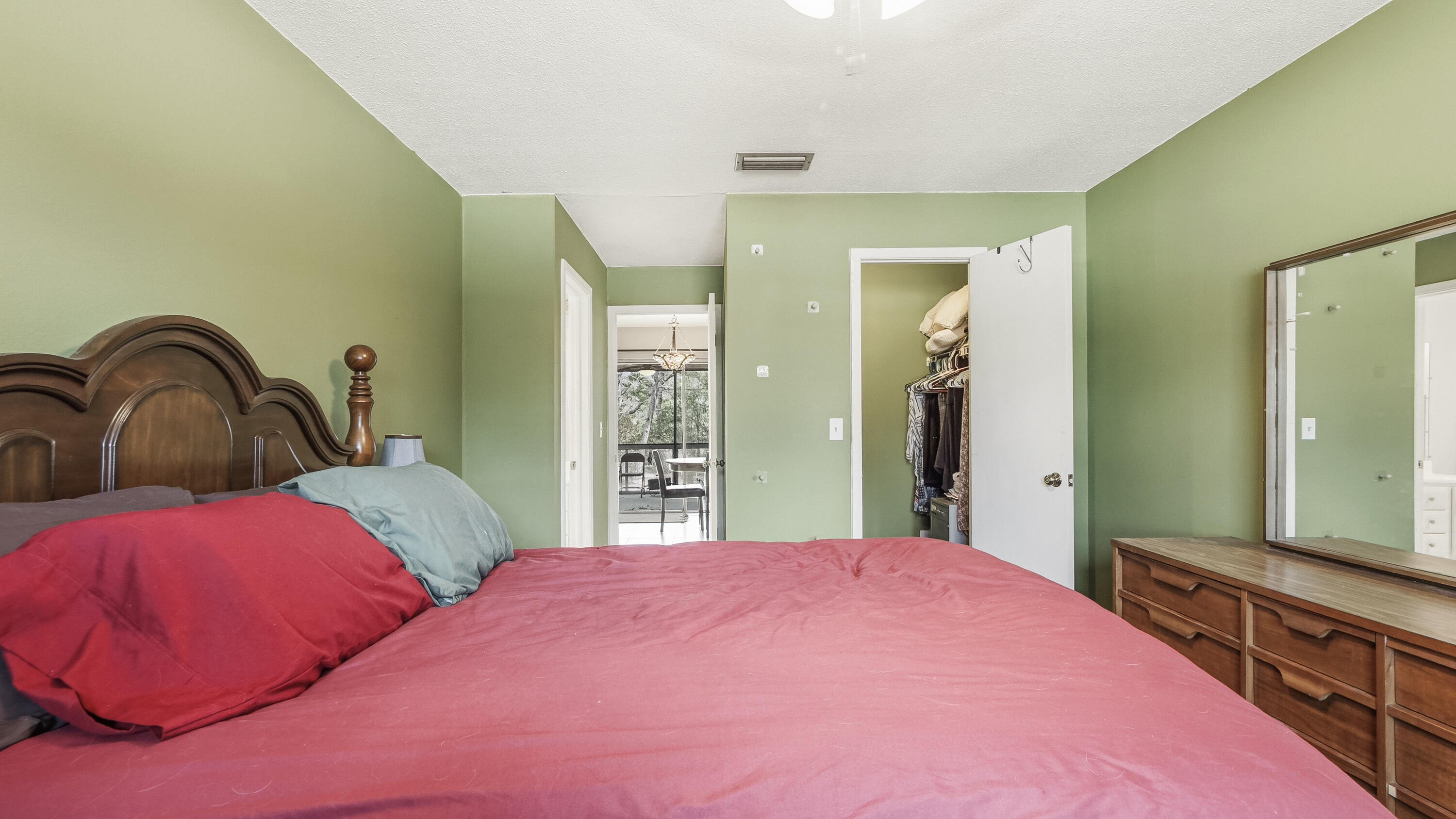 4335 Country Club Boulevard Chipley, FL 32428 - Photo 13 of 28 a bedroom with two beds and a large mirror