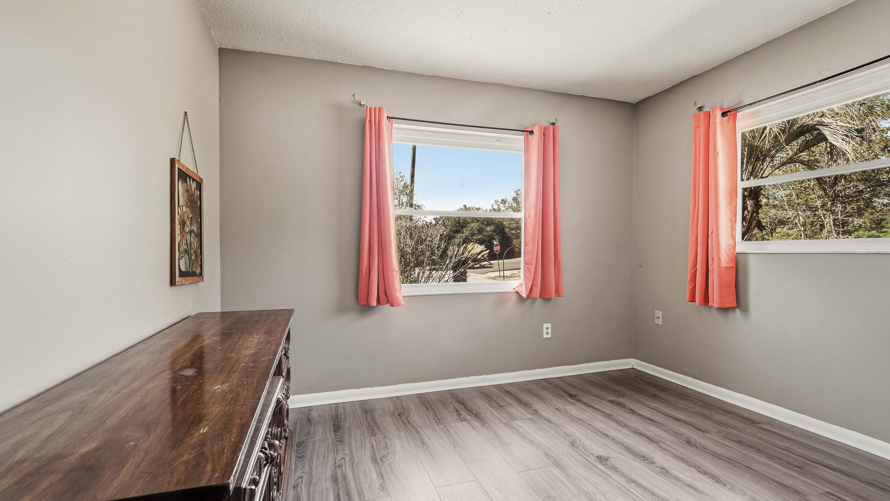 4335 Country Club Boulevard Chipley, FL 32428 - Photo 18 of 28 a view of an empty room with wooden floor and a window