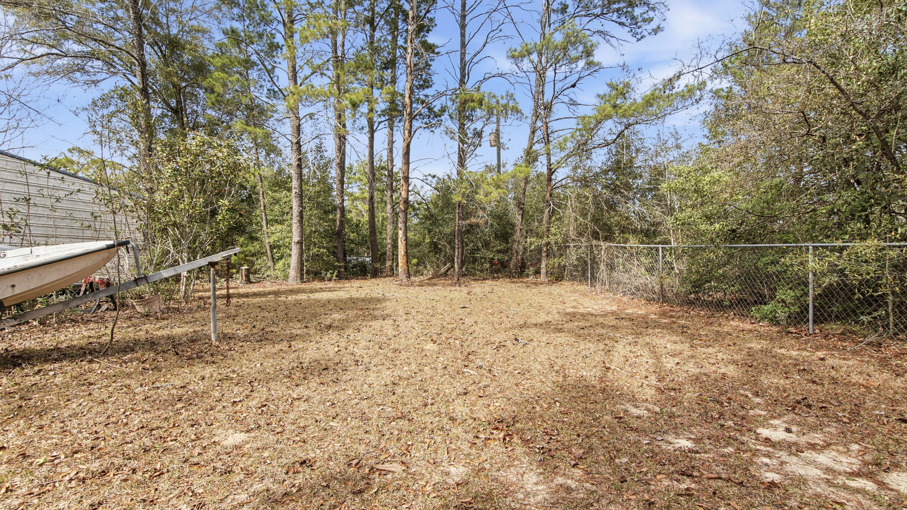 4335 Country Club Boulevard Chipley, FL 32428 - Photo 24 of 28 a view of a yard with large trees