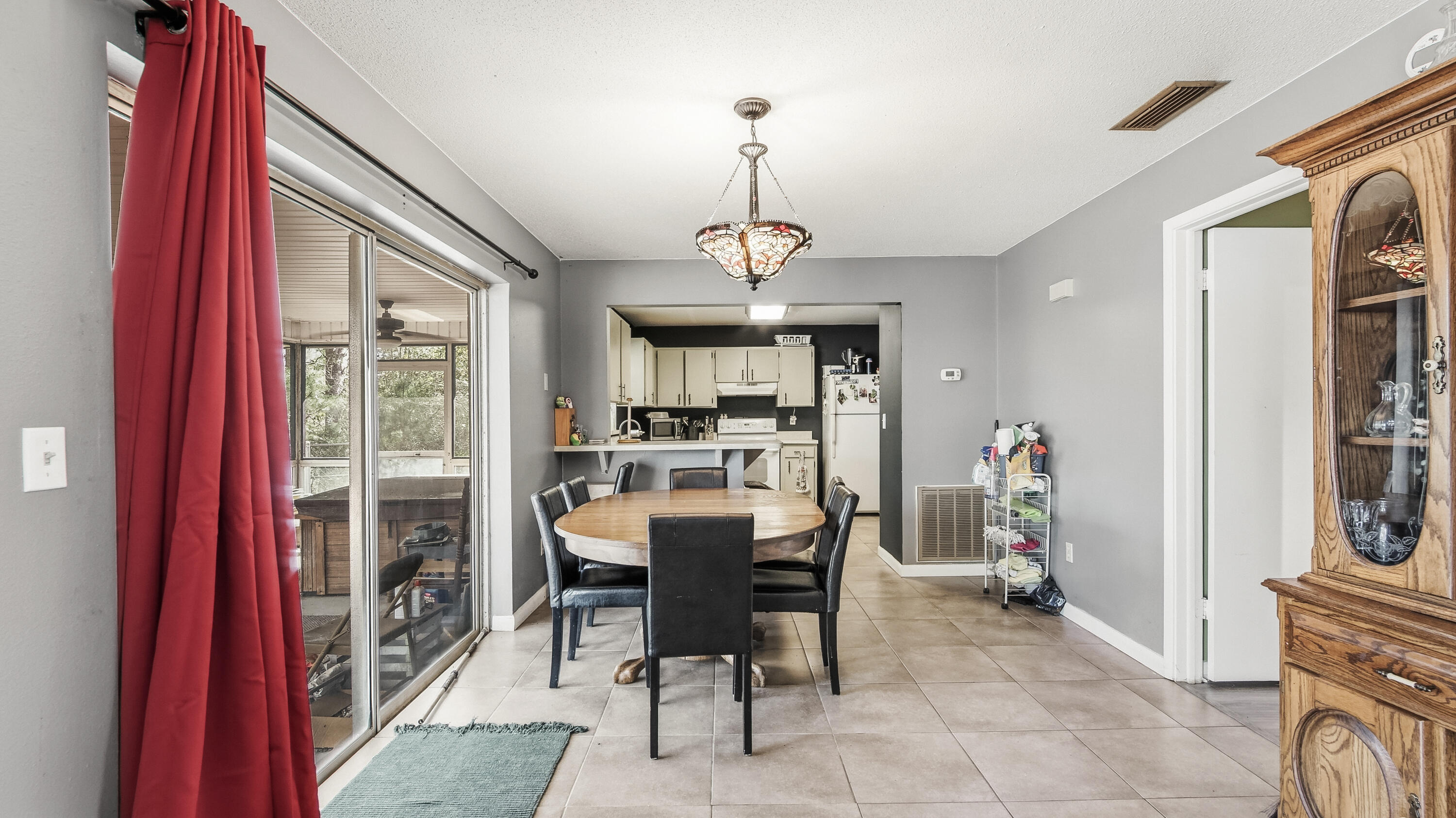 4335 Country Club Boulevard Chipley, FL 32428 - Photo 10 of 28 a view of a dining room with furniture window and outside view