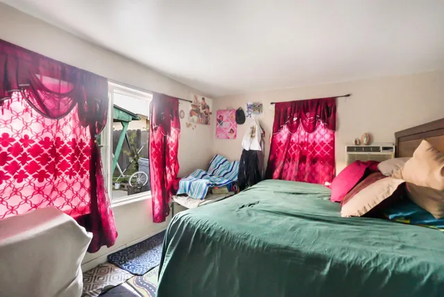 a bed room with a bed and a couch