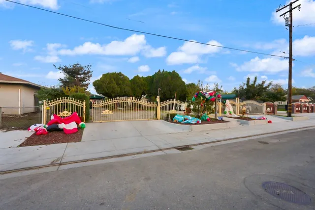 a view of a street with a cars parked on the road