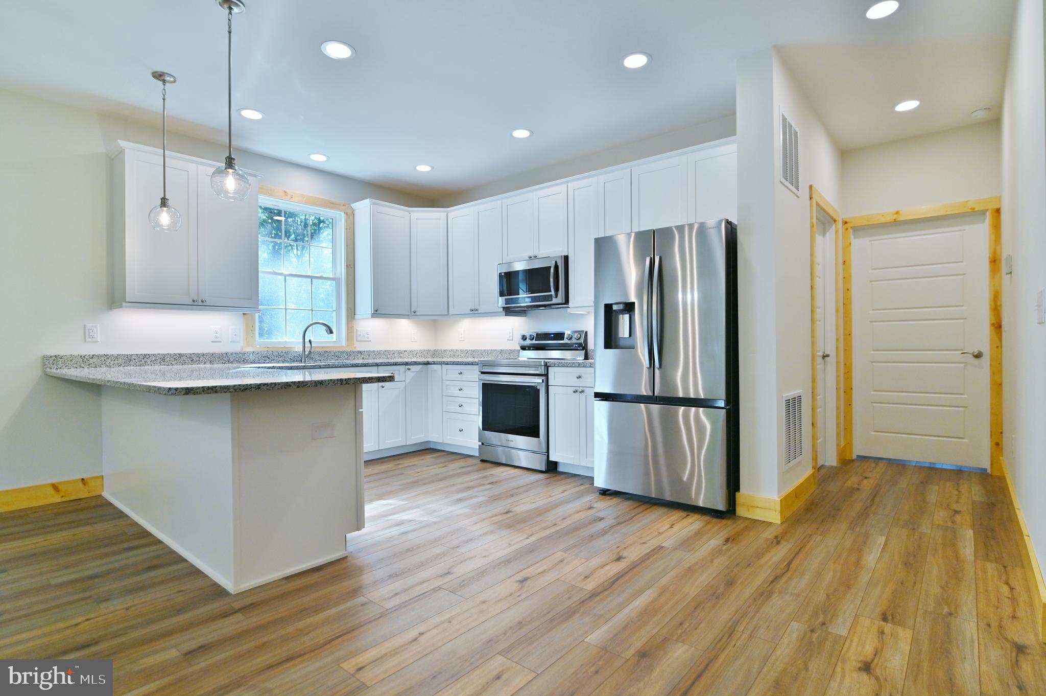 8125 Supinlick Ridge Road Mount Jackson, VA 22842 - Photo 75 of 76 Open Floor Plan with a Beautiful White Kitchen