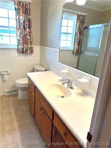 a bathroom with a sink and a toilet