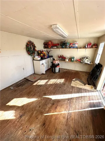 a view of a room with wooden walls