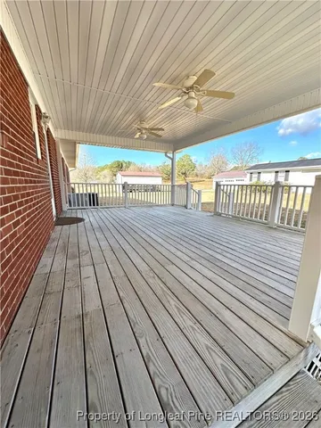 a view of balcony with wooden floor