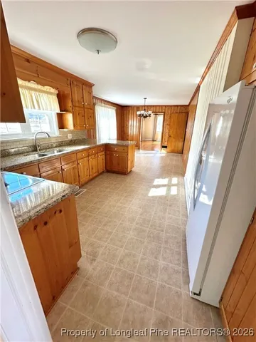 a view of a kitchen with furniture and a window