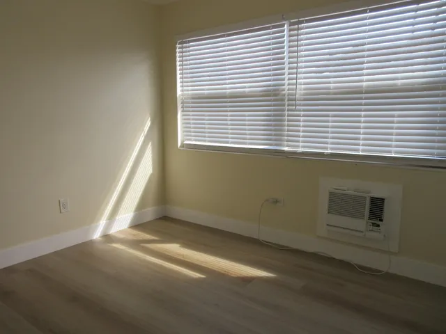 a view of a room that has a window in it