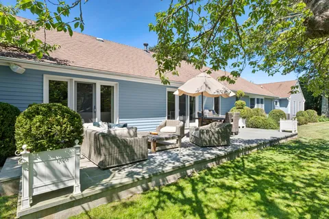a view of house with patio outdoor seating